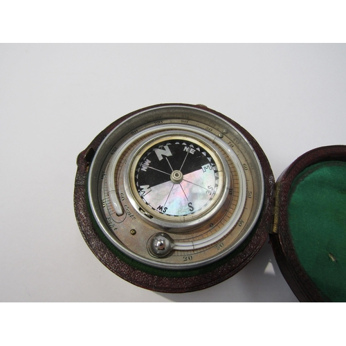 8090 - A leather cased compass/hydrometer and stopwatch with mother of pearl compass face and barometer