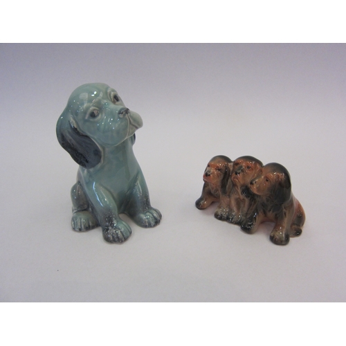 1021 - A Beswick Lollopy Dog - seated Puppy in blue gloss, model no. 454 together with Beswick Three Puppie... 
