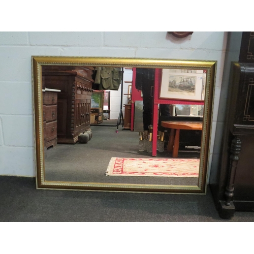 1067 - A gilt frame bevel edged wall mirror, 75cm x 100cm