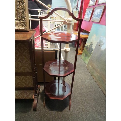 1079 - A mahogany three tier cake stand