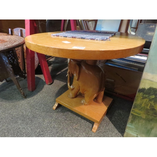 1086 - A carved hardwood elephant coffee table, 47cm tall x 56cm diameter