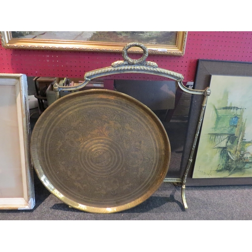 1096 - A Regency free-standing brass and mesh fire guard and a brass charger, 60cm diameter