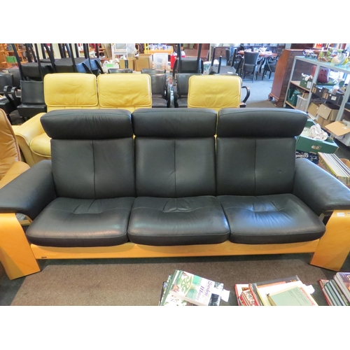 1210 - A Stressless three seater leather reclining sofa