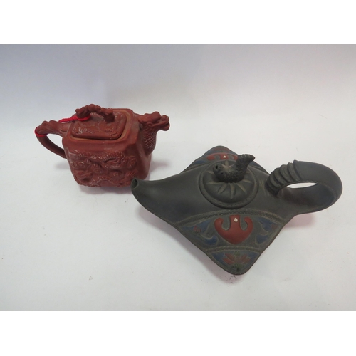 1238 - Two Oriental teapots, character marks to base