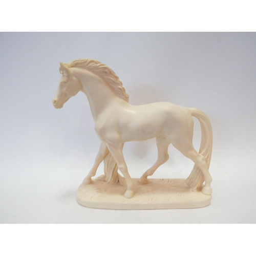 1256 - A cream resin horse figure, 22.5cm tall