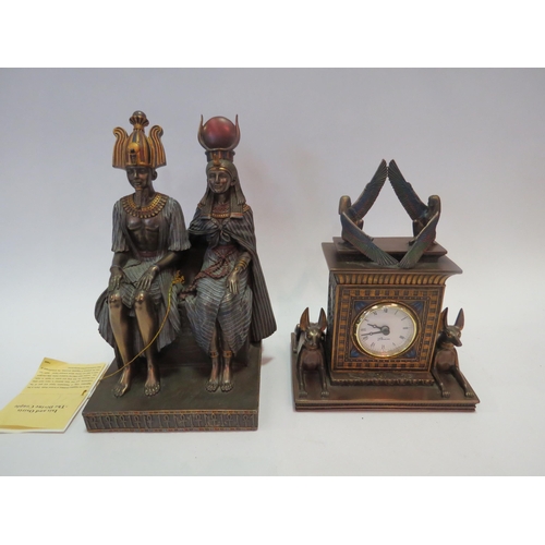 1334 - A 'Veronese' Egyptian style bronzed resin mantel clock and a pair of seated figures (2)