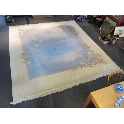 1541 - A large Chinese rug, blue and cream ground with foliate design and tasselled ends, 360cm x 335cm  (E... 