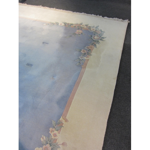 1541 - A large Chinese rug, blue and cream ground with foliate design and tasselled ends, 360cm x 335cm  (E... 