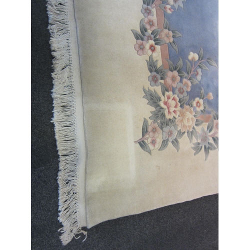 1541 - A large Chinese rug, blue and cream ground with foliate design and tasselled ends, 360cm x 335cm  (E... 