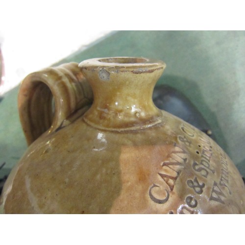 4152 - A large stoneware flagon advertising Cann & Clarke Wine & Spirit Merchants, Wymondham, 40cm tall