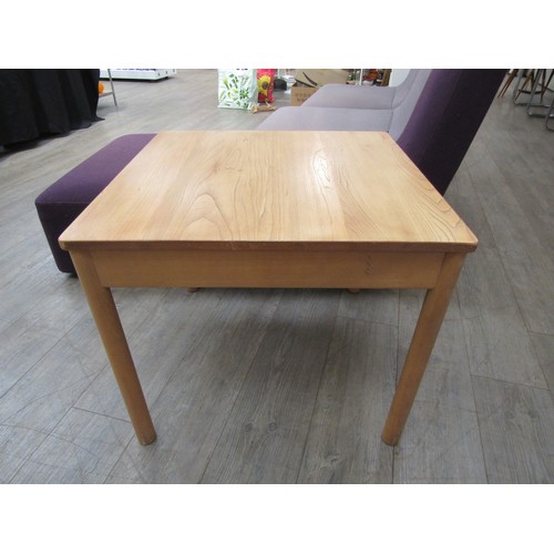 2431 - An Ercol beech coffee table with cylindrical legs, gold label c1981-1995, 64cm sq