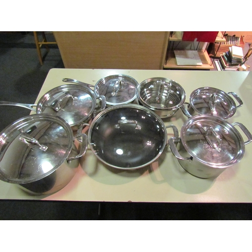 1235 - A selection of Le Creuset stainless steel cooking pans including steamer, wok, frying pans, saucepan... 