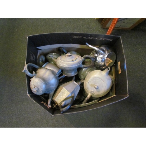 1311 - A box containing pewter teapots, etc