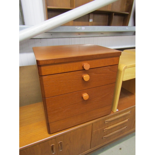 2422 - A pair of Stag 1970's teak three drawer bedsides