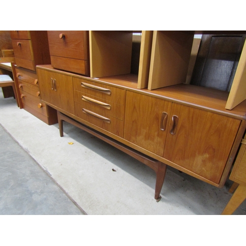 2424 - A G-Plan teak sideboard with four cupboard doors flanking three central drawers, 188cm x 46cm x 72cm... 