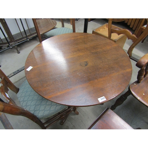 2439 - A 19th Century oak tripod wine table