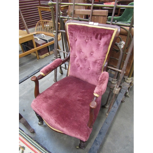 2453 - A Victorian mahogany armchair, buttoned back with dark pink velour upholstery, turned and fluted sup... 