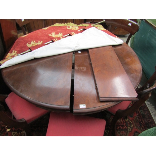 2458 - A 19th Century mahogany extending dining table with three leaves