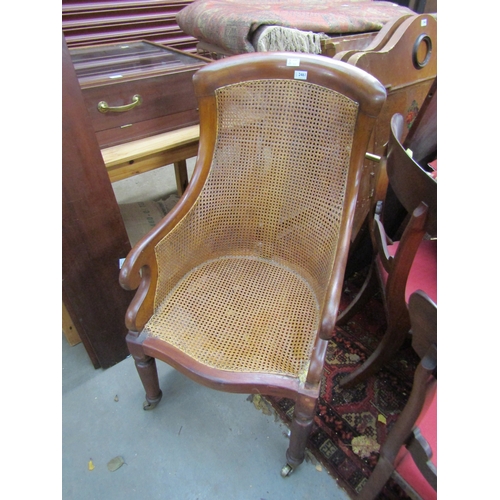 2461 - A 19th Century walnut framed bergere armchair a/f