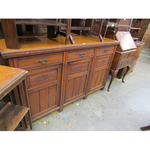 2468 - An Edwardian oak three drawer three door sideboard        (E) £40-60