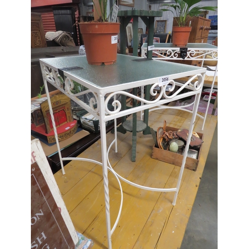 2056 - A pair of wrought iron garden tables with glass tops