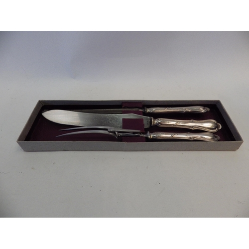 1400 - A silver handled carving set, marked Sheffield, boxed