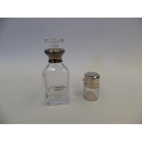 1433 - A silver banded glass scent bottle together with a planished silver and glass vanity jar (2)