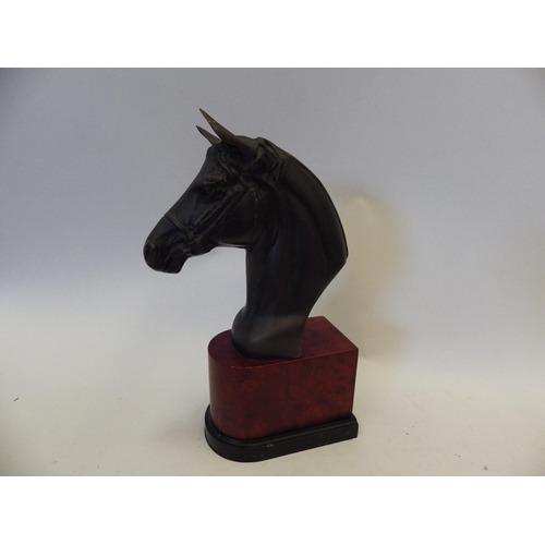 1450 - A pair of metal horse head book-ends on faux mahogany bases, 30.5cm tall