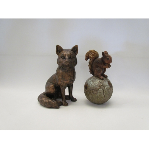 1469 - A bronzed effect figure of a seated fox, 20.5cm tall, and a squirrel on a ball with acorns, 20cm tal... 