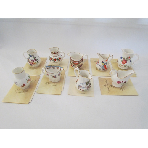 1536 - Nine Royal Worcester miniature jugs with certificates (9)   (R)  £20