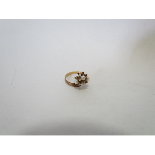 1388 - A 9ct gold floral ring set with four pearls  (R)  £50