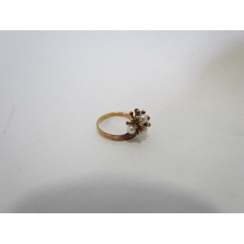 1388 - A 9ct gold floral ring set with four pearls  (R)  £50