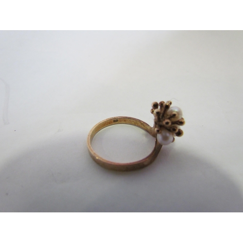 1388 - A 9ct gold floral ring set with four pearls  (R)  £50