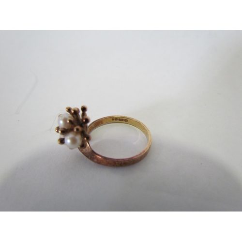 1388 - A 9ct gold floral ring set with four pearls  (R)  £50