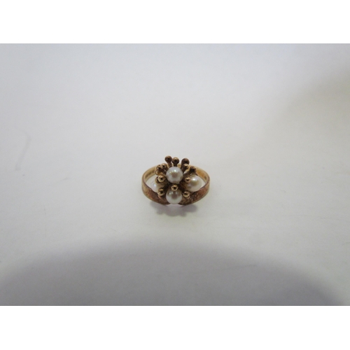 1388 - A 9ct gold floral ring set with four pearls  (R)  £50