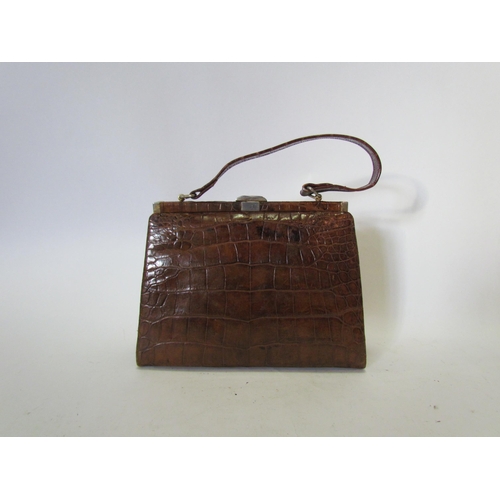 1458 - A vintage crocodile skin handbag