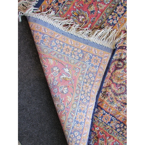 1528 - A Keshan foliate design carpet, multiple borders and tasselled ends, 225cm x 147cm