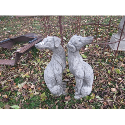 9068 - A pair of composition seated dogs, 22