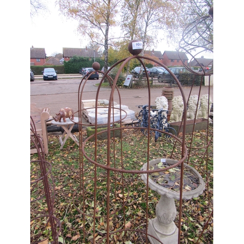 9069 - A pair of steel rust finish ball top obelisks