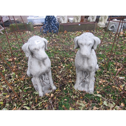 9073 - A pair of composition seated hounds, 28