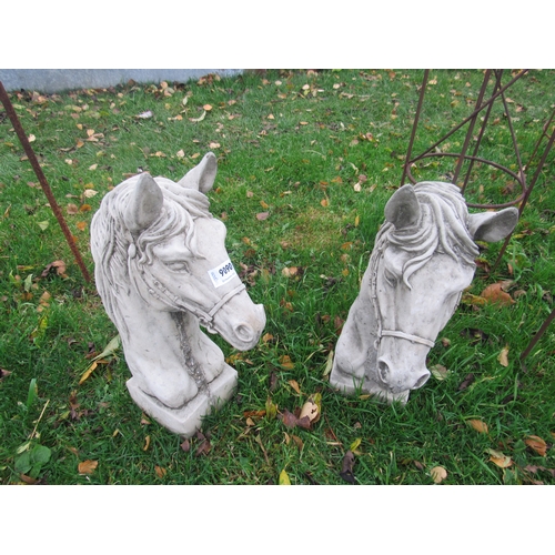 9090 - A pair of composition horse head pier finials, 17