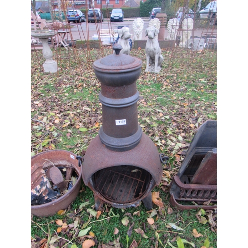 9135 - A cast iron chiminea, 34