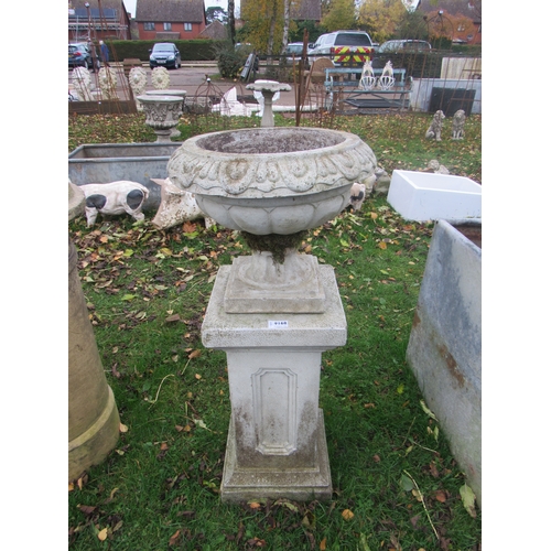 9168 - A composition semi-gadrooned urn on plinth, 36