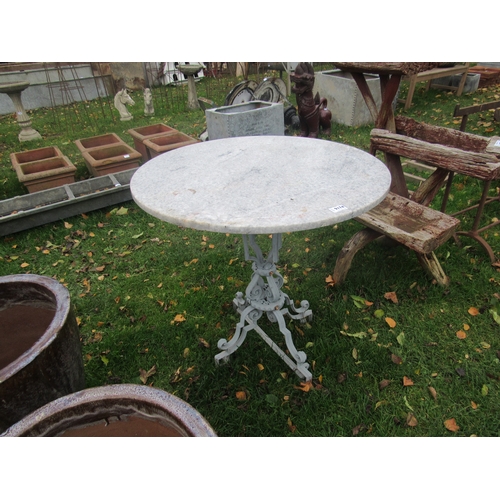 9174 - A cast iron based, round marble top table, 28