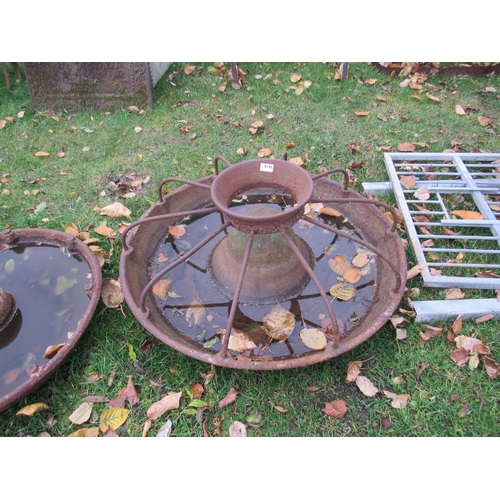 9198 - A circular iron pig trough with dividers