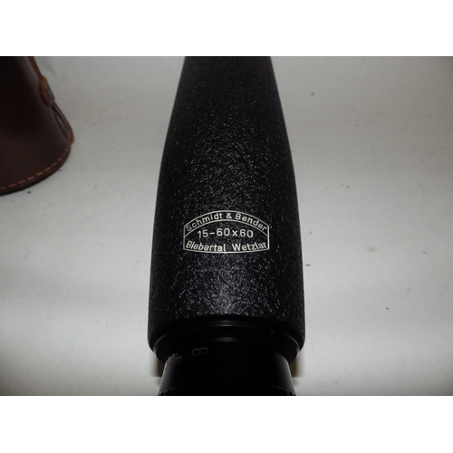 5012 - A Schmidt & Bender three stage 15-60x60 spotting scope with leather case, case a/f