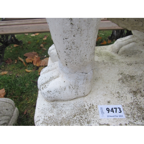 9473 - A pair of composition seated lions on shaped acanthus leaf plinths, 40