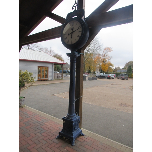 9506 - A blue painted cast alloy set of two lamp posts with shaped plastic shades and matching clock on pos... 