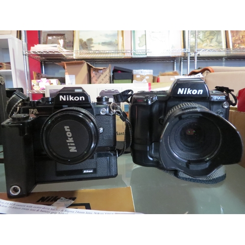 5040 - A Nikon FA SLR with Motor-drive MD-15 & a Nikon F90X with a MB-10 battery grip.