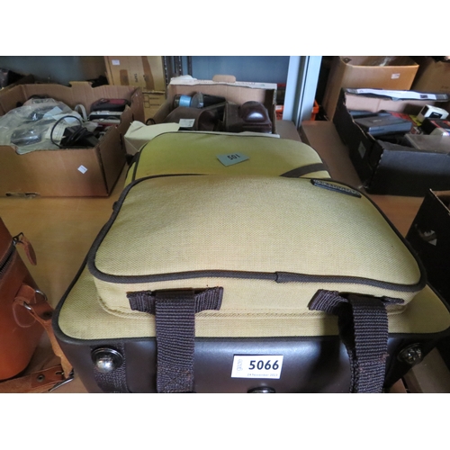 5066 - A mustard coloured camera bag with a an assortment of camera gear including a Nikon 80-200mm zoom le... 